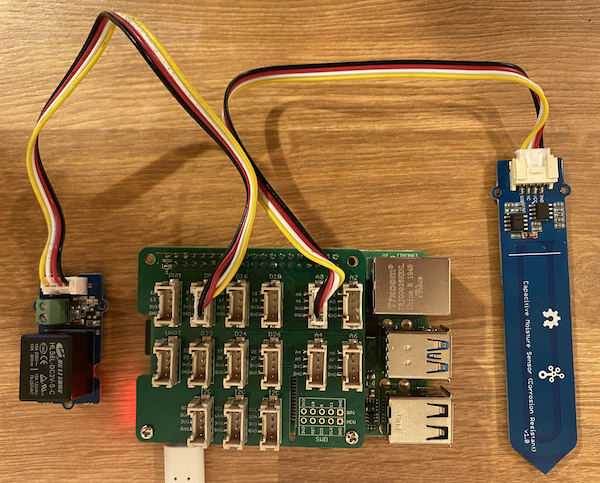 The grove relay connected to the D5 socket, and the soil moisture sensor connected to the A0 socket